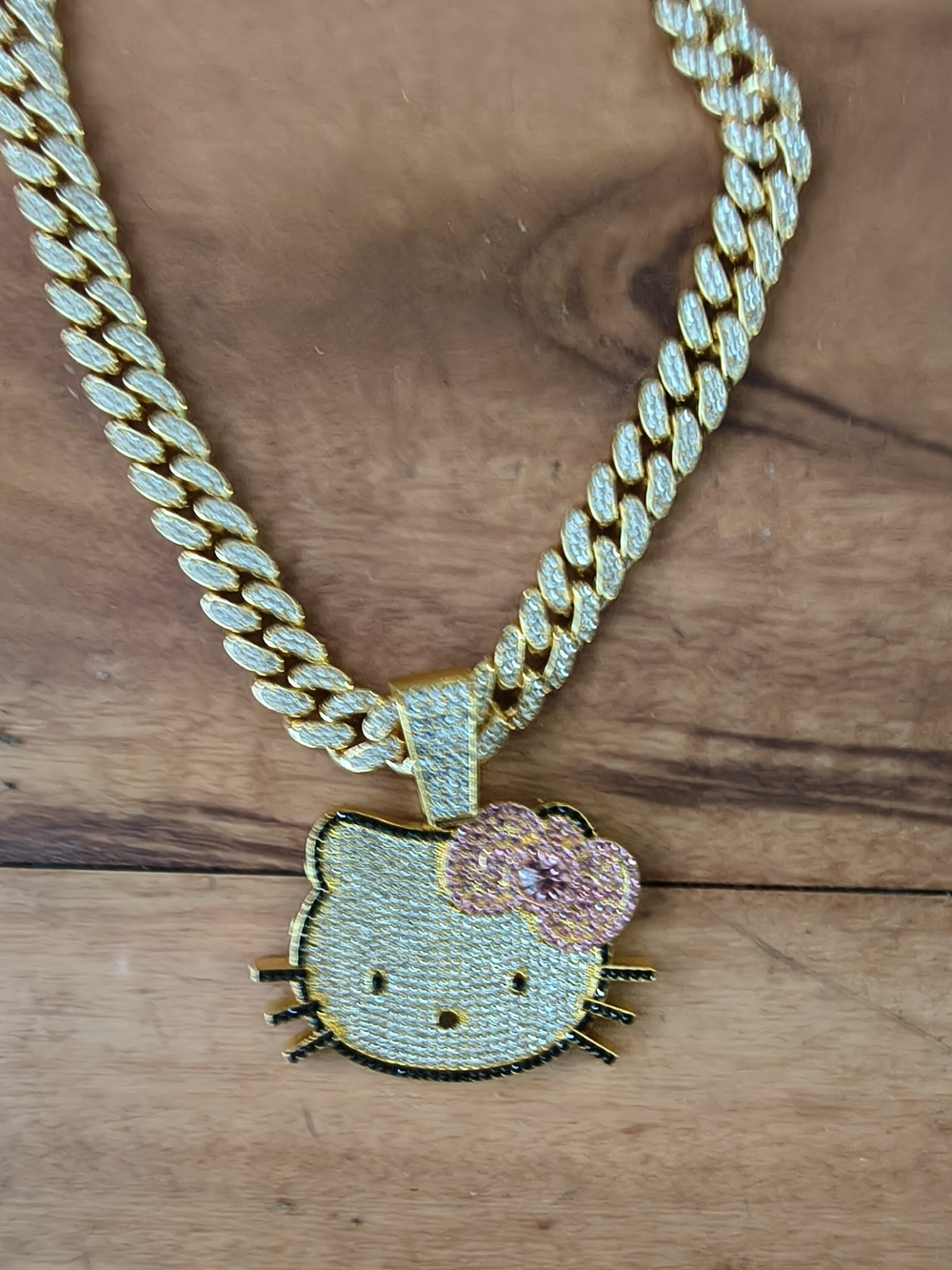 Hello Kitty Gold-Tone Pendant Necklace with Pink Bow Accents